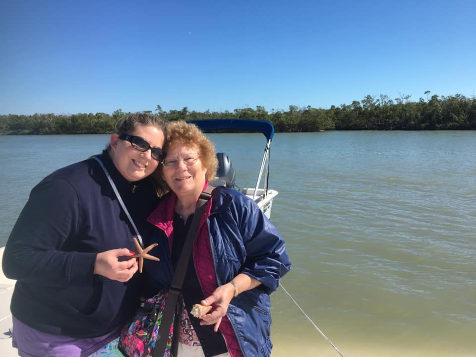 A mother and daughter hunting for seashells together
